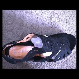 Platform sandals with a small zipper in the back .